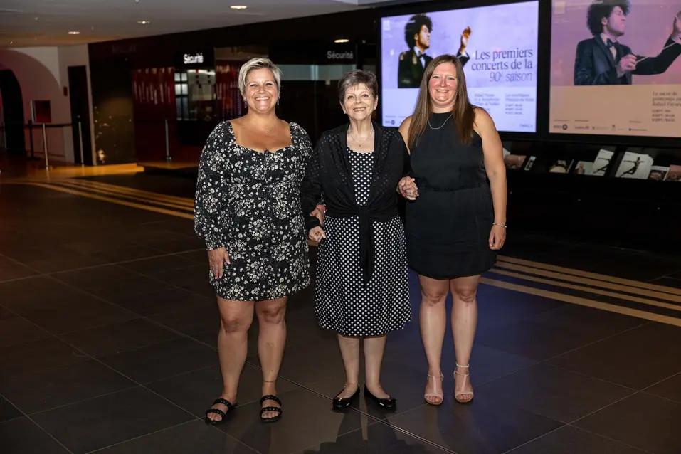 Lise enjoys a night out with her two daughters at place des arts in Motreal, watching